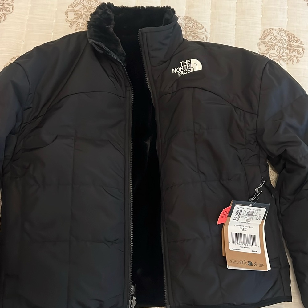 Kid’s reversible north face coat size small (7/8)